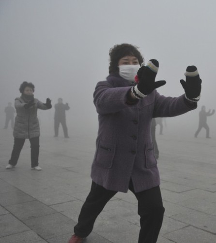 Retirees play Taichi during their morning exercise on a hazy day in Fuyang city, in central China's Anhui province, Monday Jan. 14, 2013. Air pollution is a major problem in China due to the country's rapid pace of industrialization, reliance on coal power, explosive growth in car ownership and disregard for environmental laws. (AP Photo) CHINA OUT